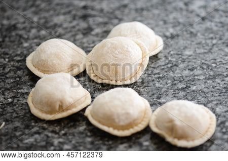 Home Made Pasta: Cooking Fresh Sorrentinos On Top Af A Grey Table