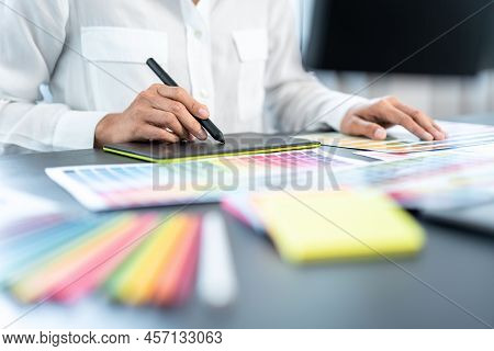 Young Creative Graphic Designer Working On Color Selection And Drawing On Graphics Tablet At Workpla