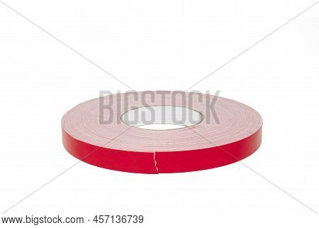 Double Sided Sticky Tape Reel. Red Ribbon Roll Isolated On White Background