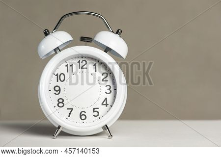 Alarm Clock Without Arrows. White Classic Alarm Clock On A White Background Without Arrows, Space To