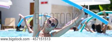Sportive Woman Doing Exercises In The Pool, Water Aerobics, Close-up. Aquafitness For Weight Loss. R