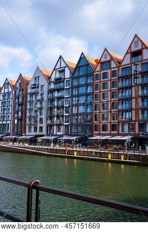 Gdansk, Poland May 2022, Modern Buildings On Granary Island Over The Motlawa River In Old Town. Tour