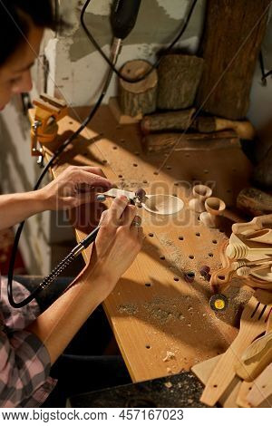 Female Using Power Working Tools Graver For Wooden Utensils Spoon