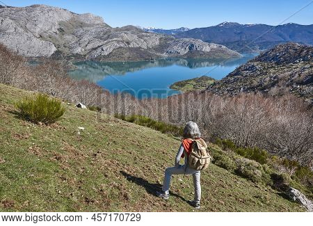 Picturesque Reservoir And Mountain Landscape In Riano. Hikers. Spain