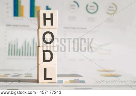 Business And Technology Concept. On The Wooden Blocks Inscription Hodl