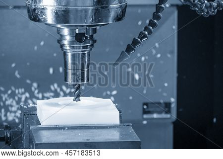 The  Cnc Milling Machine Cutting The Nylon 6 Material Part With Flat End Mill Tool. The Jig And Fixt