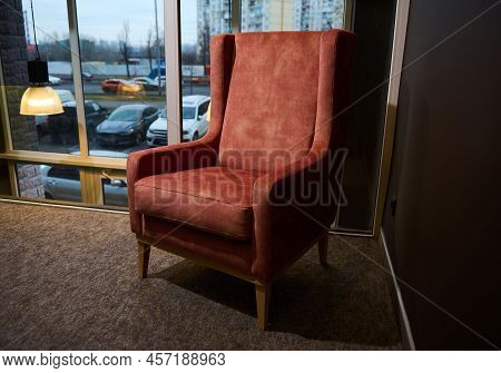 Velour Coral Vintage Armchair In Home Interior Design Studio Or Furniture Store Against Karge Window