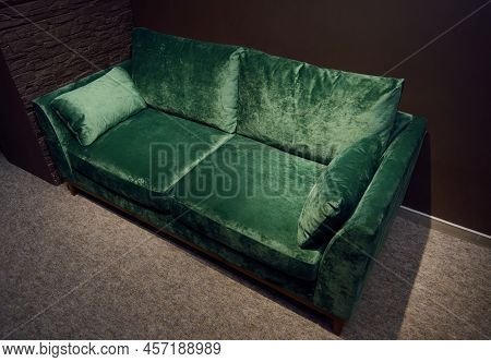 Comfortable Upholstered Velour Green Couch Displayed For Sale In The Furniture Store Showroom. Exhib