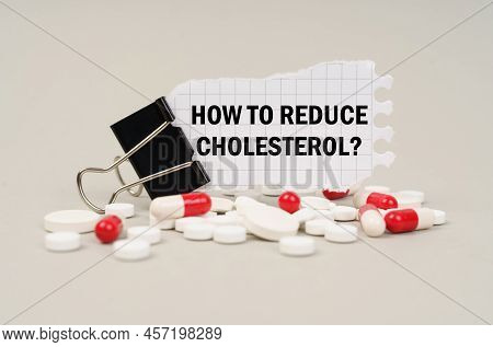 Medical Concept. Among The Tablets And Capsules Is A Clip With Paper On Which Is Written - How To Re