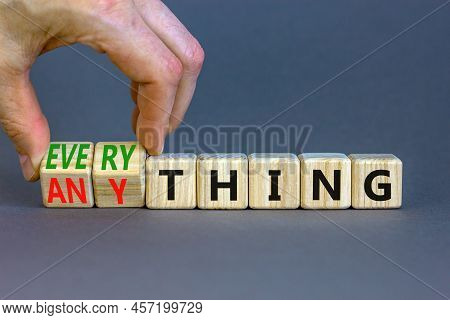Anything Or Everything Symbol. Businessman Turns Cubes And Changes The Concept Word Anything To Ever