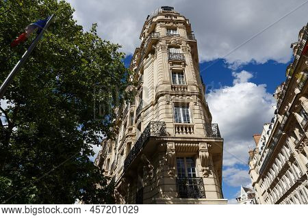 The Facades Of Traditional French Houses With Typical Balconies And Windows. Paris.