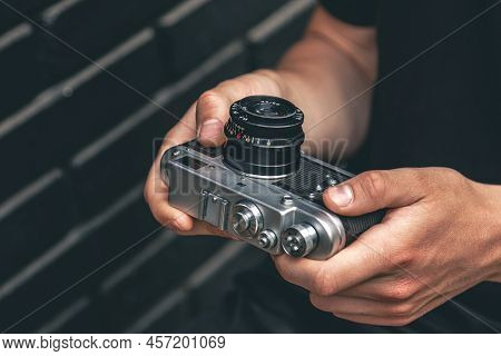Close-up, Vintage Film Retro Camera In Male Hands.