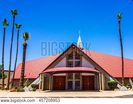 Modern Church With Canopy Entrance And Palm Trees