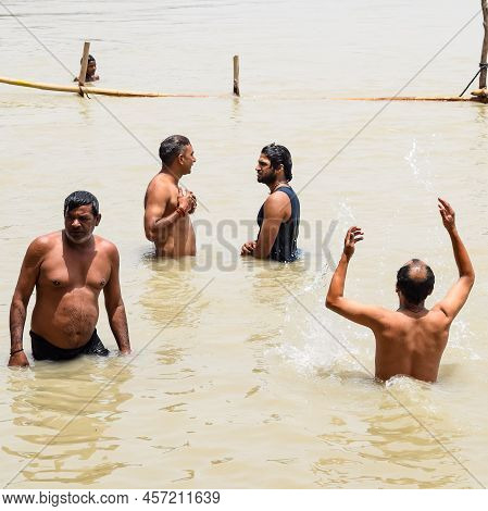Garh Mukteshwar, Uttar Pradesh, India - June 11 2022 - People Are Taking Holy Dip On The Occasion Of
