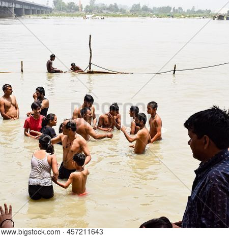Garh Mukteshwar, Uttar Pradesh, India - June 11 2022 - People Are Taking Holy Dip On The Occasion Of