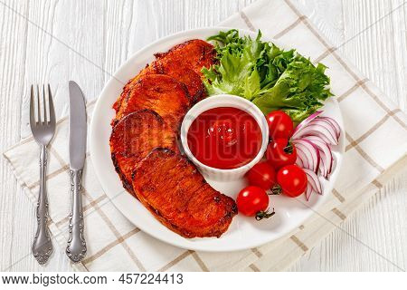 Grilled Slices Of Pork Loin Marinated In Paprika Based Sauce On White Plate With Fresh Tomatoes And 