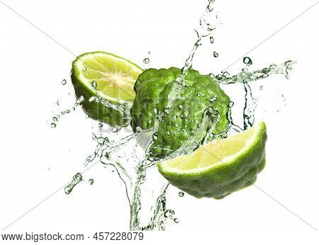 Fresh Ripe Bergamot Fruits And Splashing Water On White Background