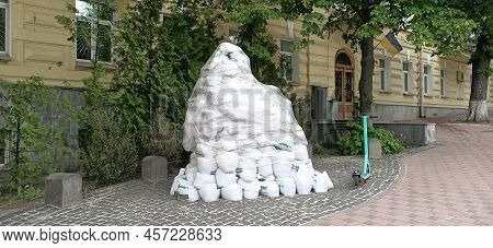 Kyiv, Ukraine June 11, 2022: Carefully Protected From The Bombing Cinema Monument To The Heroes From