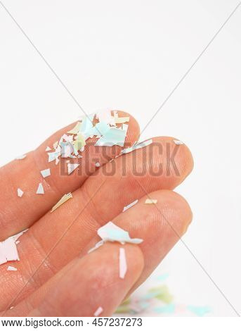 A Close-up Photo Of Microplastics Lay On Human Hand. The Idea Of Environmental Damage. Concept Of Wa