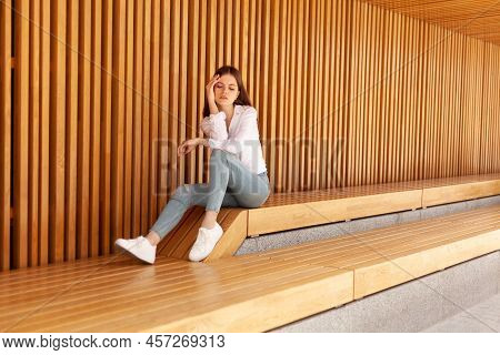 A Student During A Break Between Classes. A Tired Girl Sits On A Bench. 
Businesswoman Has A Headach