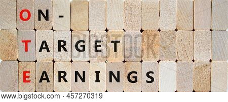 Ote On-target Earnings Symbol. Concept Words Ote On-target Earnings On Wooden Blocks On A Beautiful 