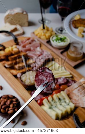Delicious Charcuterie Board With Snacks Cheese, Toast, Ham, Blue Cheese, Almonds, Caramelized Onions