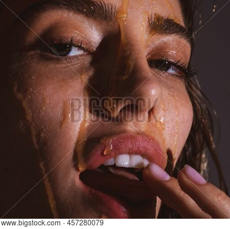 Sensual Woman With A Honey Facialmask Closeup. Beautiful Woman With Honey On Her Face. Healthy Perfe