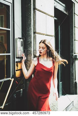 Stunning Face. Intercom, Interphone. Young Cheerful Fashionable Woman During Walking On Street. Fema