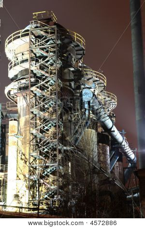 Old Rusty Industrial Building In Night