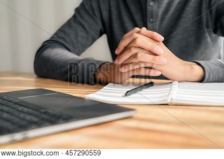 Close Up Of Man Clasped Hands Clenched Together On Table, Businessman Preparing For Job Interview, C