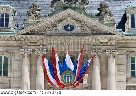 National Day Decorations On Historic Building In Luxembourg - Flags With Monogram H And Crown For Gr