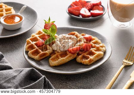 Trendy Breakfast With Croffles And Morning Coffee, Strawberries. Croissant As Waffle.