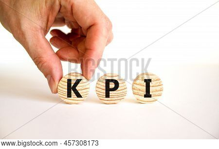Kpi, Key Performance Indicator Symbol. Concept Word Kpi, Key Performance Indicator On Wooden Circles