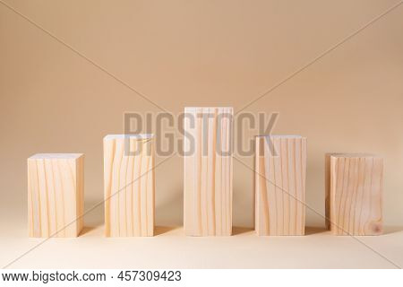 Podiums From Wooden Bars On A Beige Background. Stands For Any Product. Difference In Height. Stairs