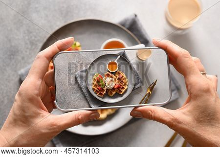 Woman Take A Photo Out Breakfast Of Croffles And Coffee With By Smartphone.