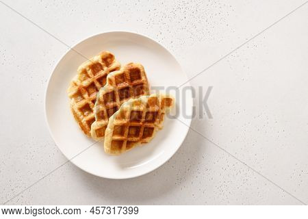 Trendy Delicious Croffles On White Plate. Croissant As Waffle. .