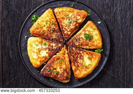 Potato Farls, Irish Potato Cakes, Potato Bread On Black Plate On Dark Wooden Table, Horizontal View 