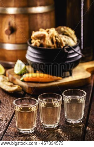 Crispy Fried Pork Rinds Or Bacon, Served With Cachaça Or Pinga, Typical Food From Minas Gerais