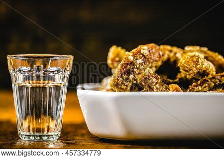 Cachaça Or Pinga, Is The Sugar Cane Brandy Produced In Brazil, Served With Crispy Pork Rinds, Or Fry