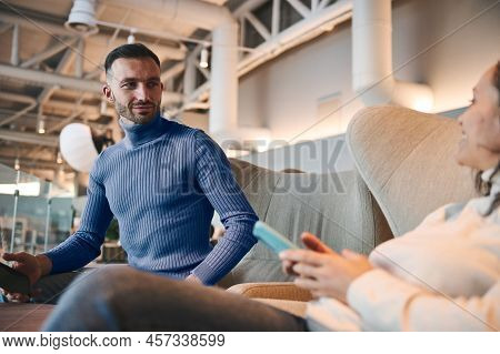 Attractive Handsome Middle-eastern Young Man, Passenger In Blue Pullover Relaxing With His Girlfrien