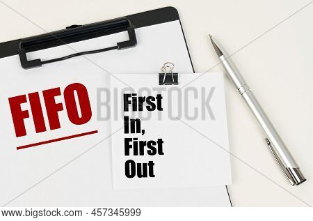 Business Concept. On The Tablet Is A Sheet Of Paper With The Inscription - Fifo And Stickers With Th