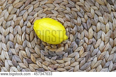 Fresh Winter One Yellow Lemon Situated On The Centre Of The Natural Cruft Rattan Structured Surface 