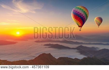 Colorful Hot Air Balloons Flying Over Mountain Misty Morning Sunrise