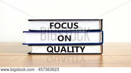 Focus On Quality Symbol. Concept Words Focus On Quality On Books On Beautiful Wooden Table White Bac