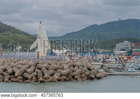 Ulsan, South Korea; June 7, 2022: Whale Shaped Lighthouse At End Of Jeongjahang South Breakwater Pie