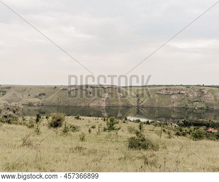 Dniester River, Ukraine. Bakota Bay View. Landscape On The Banks Of A Large River With Smooth Calm W