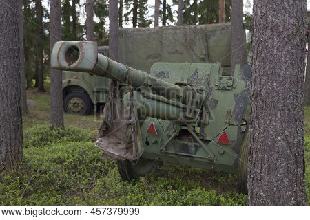 Vaasa, Finland - June 21, 2022: Cannon And Military Truck In The Forest