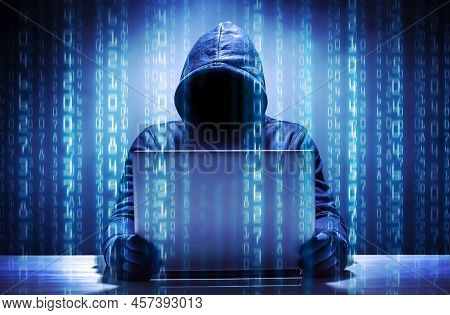 Hacker Using Laptop. Hacking The Internet Image.