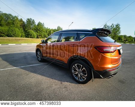 Minsk, Belarus - June 2022: Orange Geely Coolray Car.