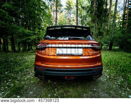 Minsk, Belarus - June 2022: Orange Geely Coolray Car.